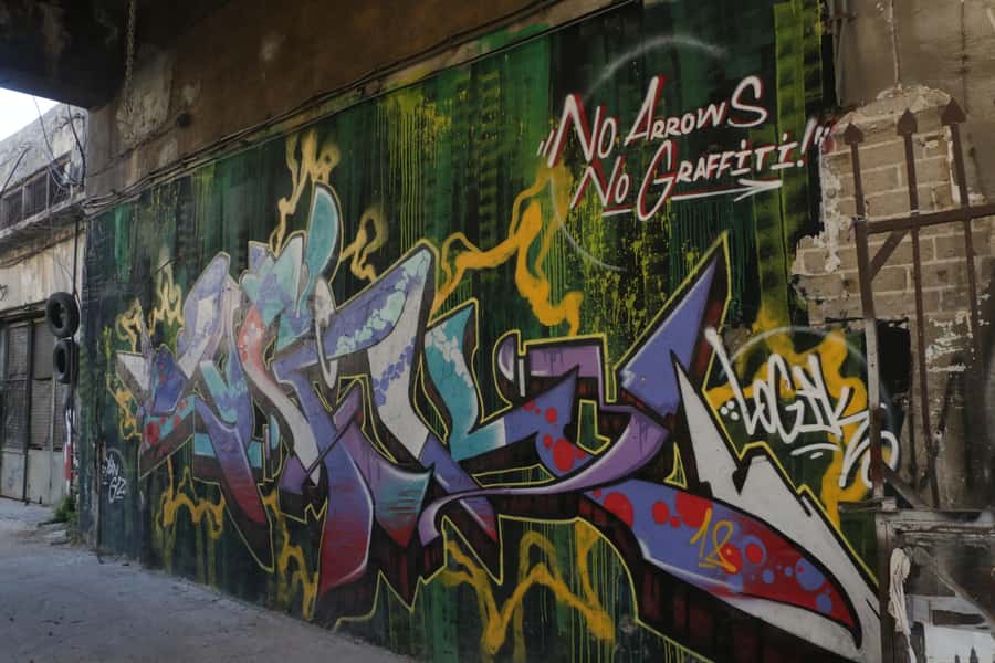 Tel Aviv: Florentin Saturday Walking Tour - Crossing into Florentin’s mural-filled streets